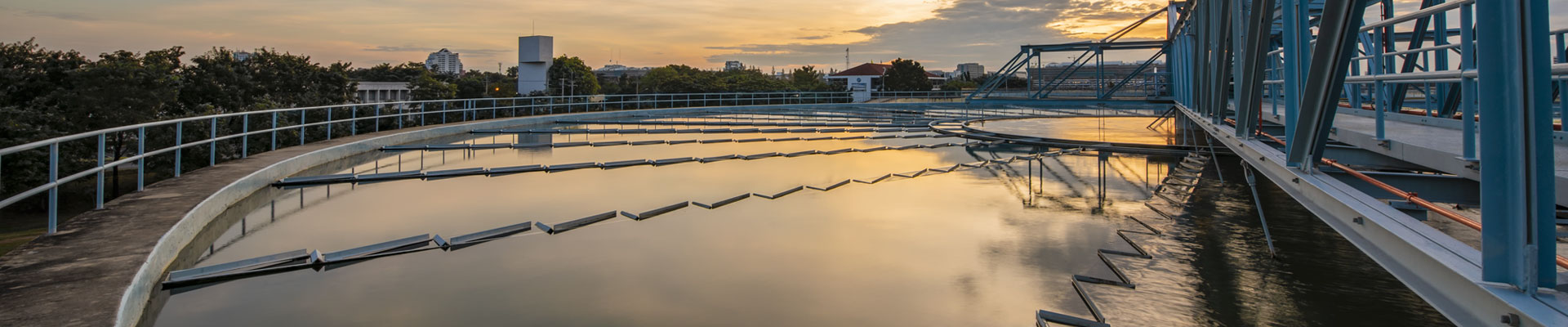 municipal wastewater treatment clarifier at dawn